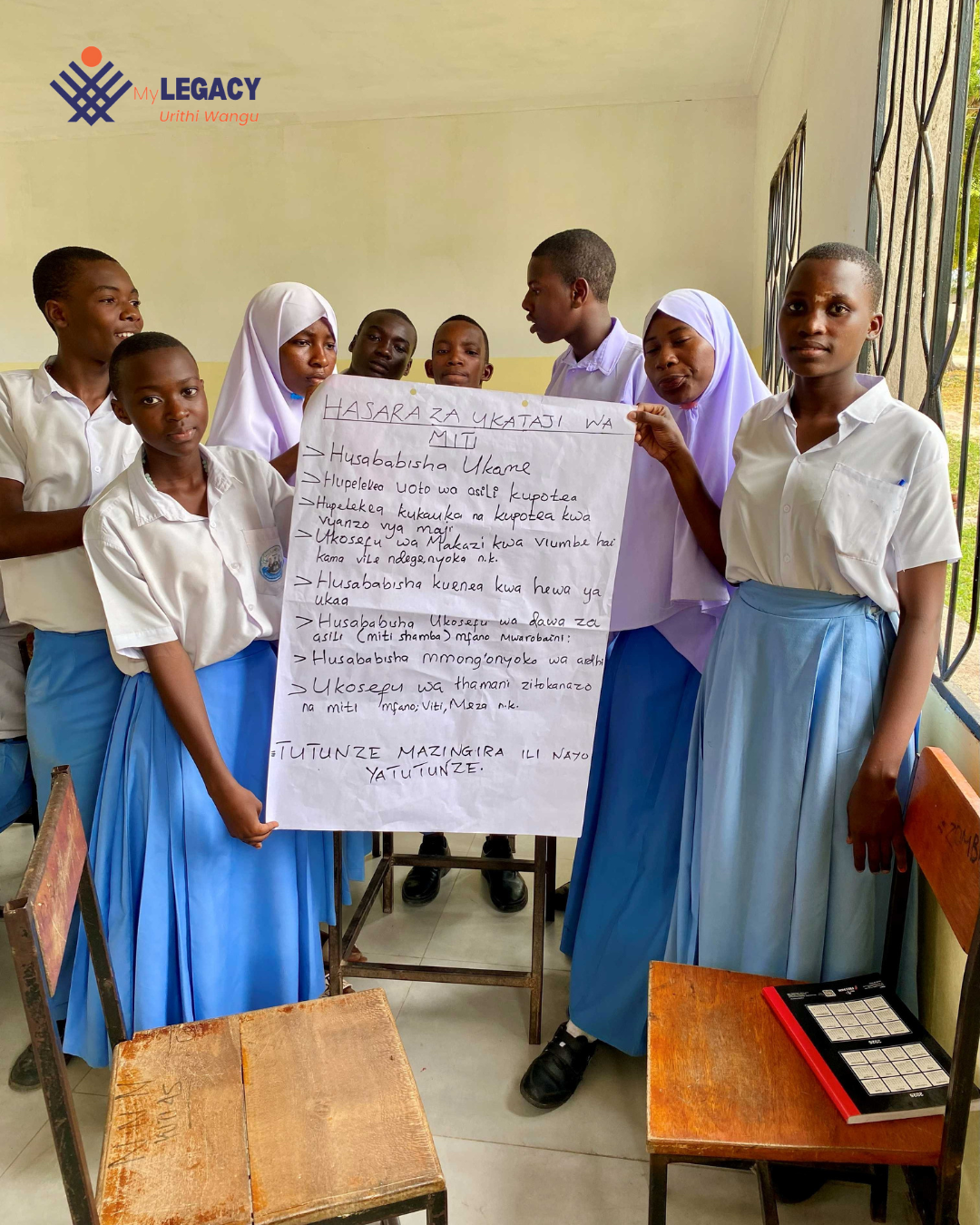 Students holding an Illustration